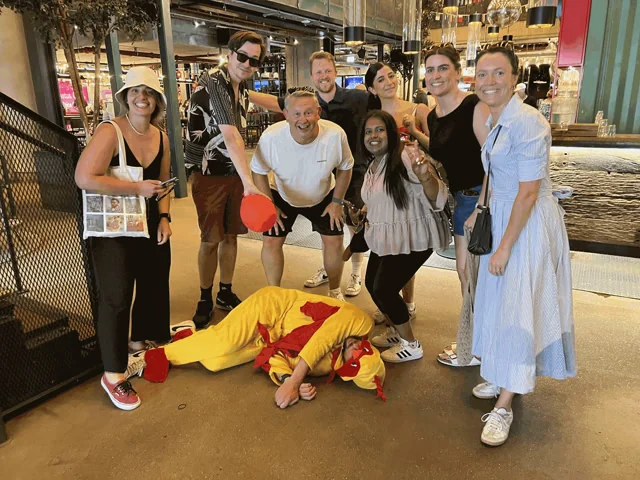 A team standing over the Chicken they just found