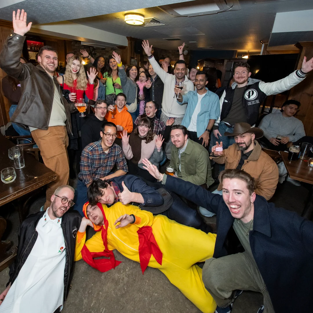 A packed pub cheering after finding the Chicken